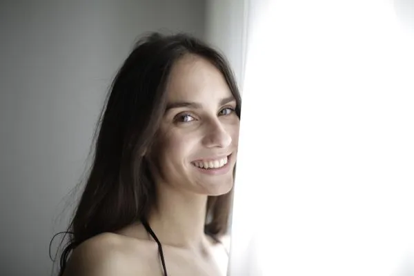 A smiling woman in her 40s